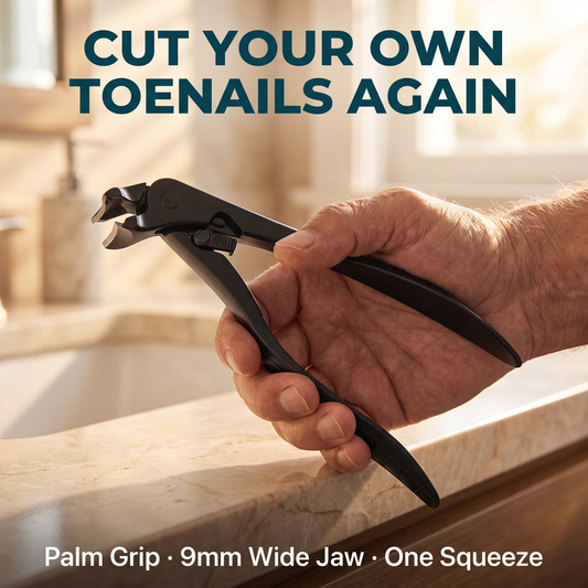 TrueToe SteadyClip adaptive toenail clipper held in hand for scale — cut your own toenails again