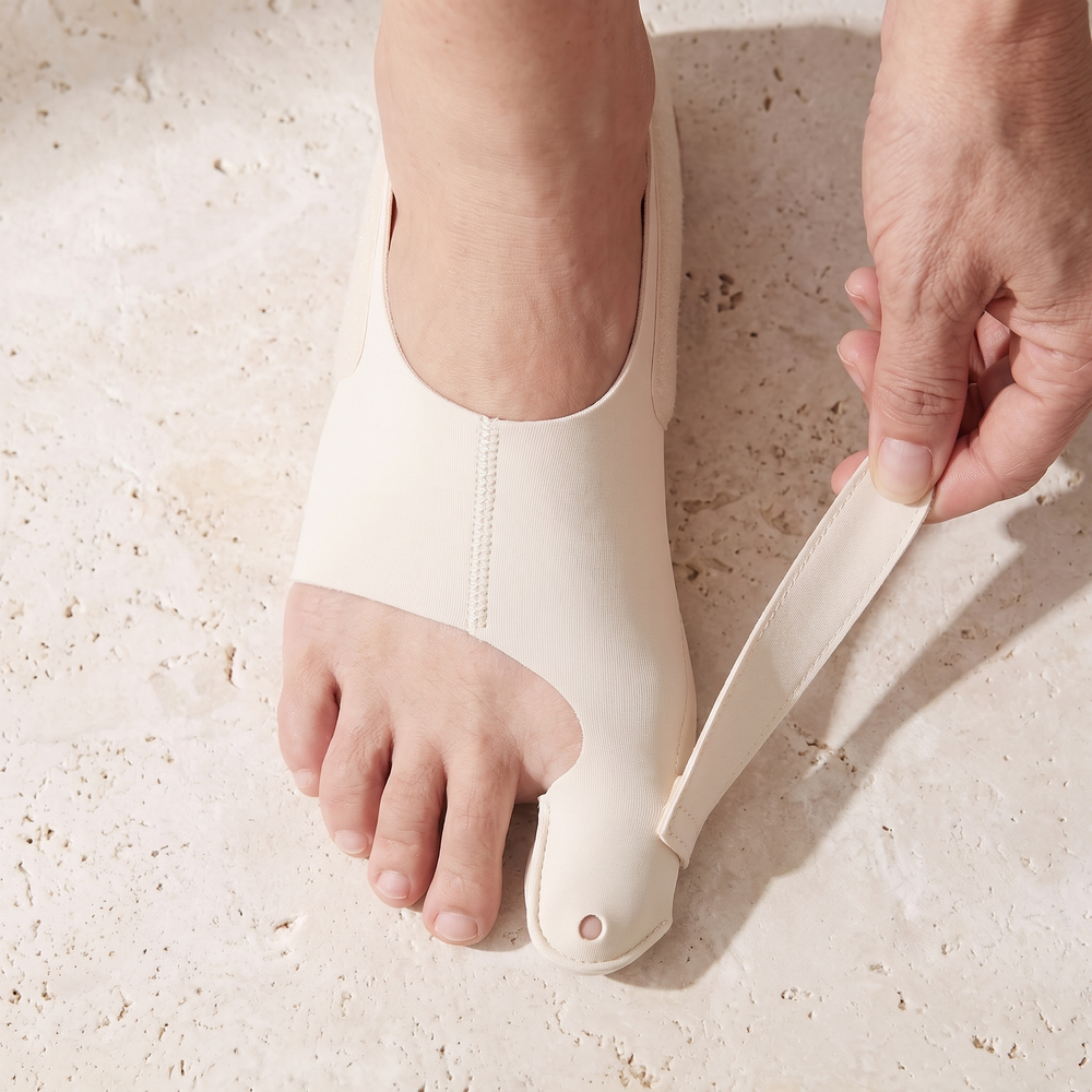 TrueToe strap with the outside hook-and-loop tab being adjusted